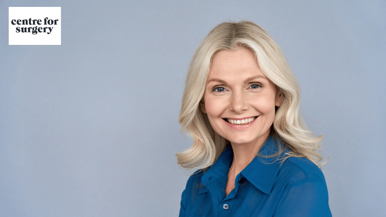 Smiling woman in her fifties, illustrating questions to ask before a facelift