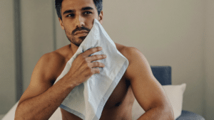 Man holding a cold compress after a nasal injury — broken nose assessment, treatment and recovery, Centre for Surgery London