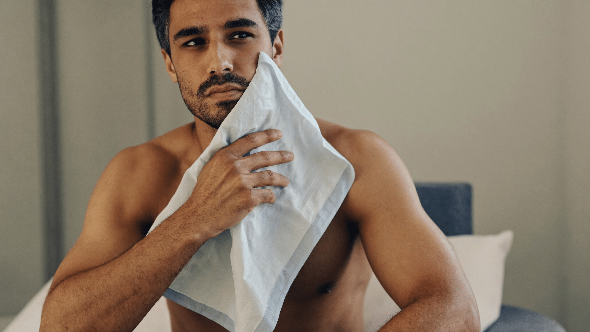 Man holding a cold compress after a nasal injury — broken nose assessment, treatment and recovery, Centre for Surgery London