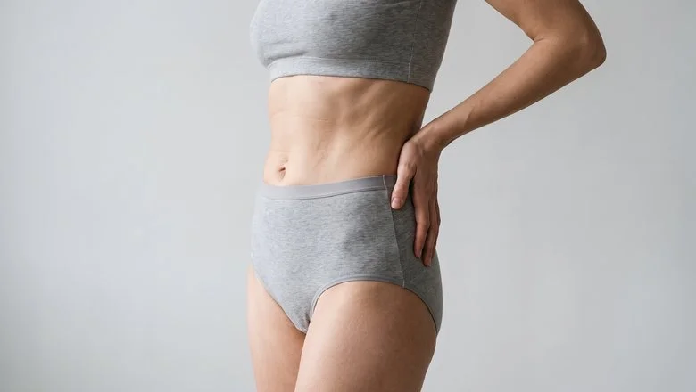 Woman in profile showing the waist and lower ribcage treated by rib remodelling waist narrowing surgery at Centre for Surgery London