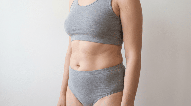 Illustrative photograph showing a B belly shape in three-quarter view, with a horizontal crease across the midline dividing the upper and lower abdomen into two curves