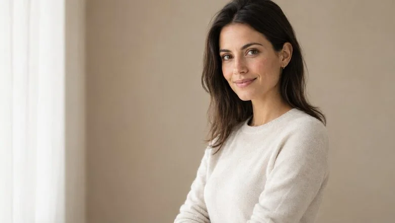 Woman in a cream knit sweater with a soft, natural silhouette — hybrid composite breast augmentation with implants and fat transfer at Centre for Surgery, Baker Street, London