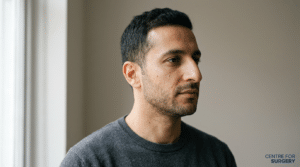 Middle Eastern rhinoplasty consultation at Centre for Surgery London — side profile showing dorsal hump and nasal tip position
