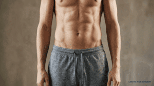 Lean male torso showing visible Adonis belt V-lines at the lower abdomen