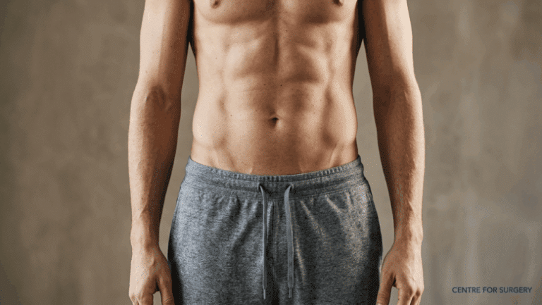 Lean male torso showing visible Adonis belt V-lines at the lower abdomen